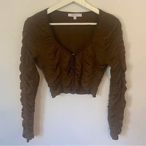 Chocolate brown cropped long sleeve top with puffy sleeves and corset hooks